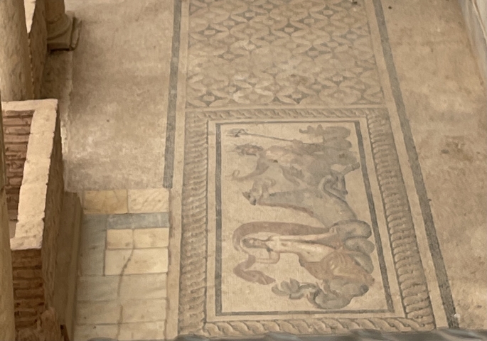 Ancient mosaic artwork in a historical site.