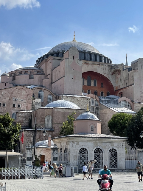       Exterior view of the Hagia Sophia with domes and arches.
  