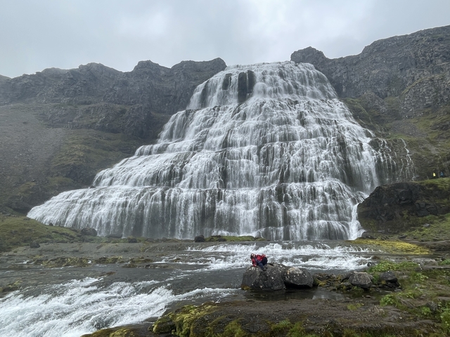       Massive waterfall carving through rocky cliffs.
  