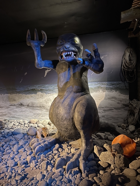       Artistic statue on a beach background.
  