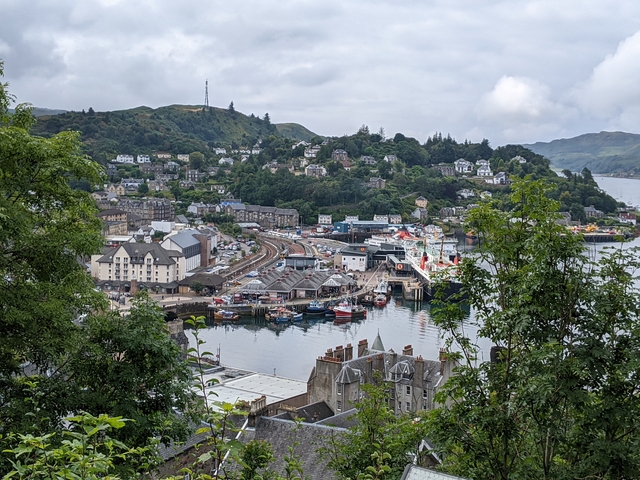Aerial view of a coastal town with boats in the harbor.