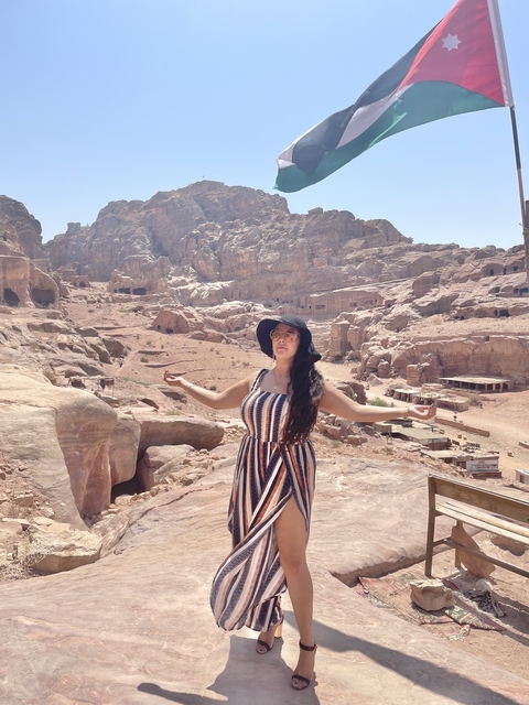       Person standing in an expansive desert landscape.
  