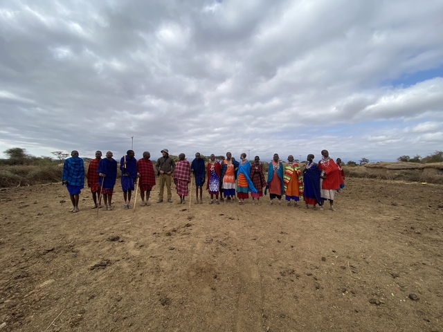       Group of people in colorful traditional attire.
  