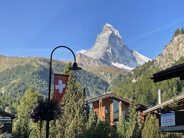 View of the Matterhorn mountain with Swiss flag.