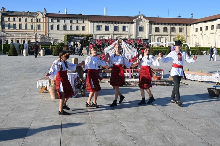       Traditional dancers performing outdoors.
  