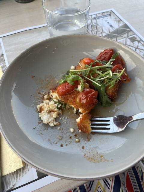       Plate of Greek food with a fork
  