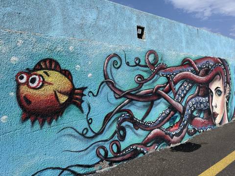       Colorful street art of a fish and octopus
  