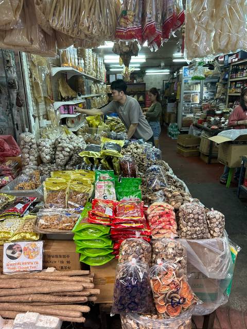       Market with various dried goods and snacks for sale.
  
