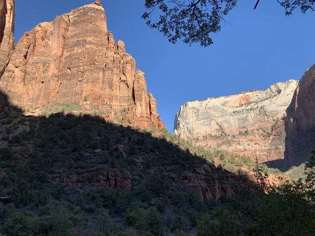 Rocky landscape with mountains in the distance.