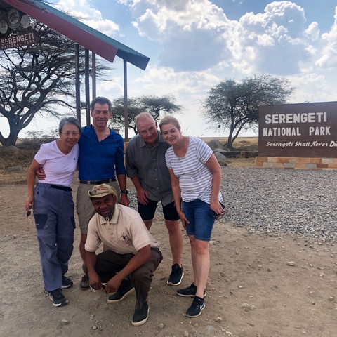       Group photo at entrance of Serengeti National Park.
  
