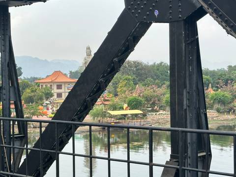 Upside-down view of a bridge with reflections.