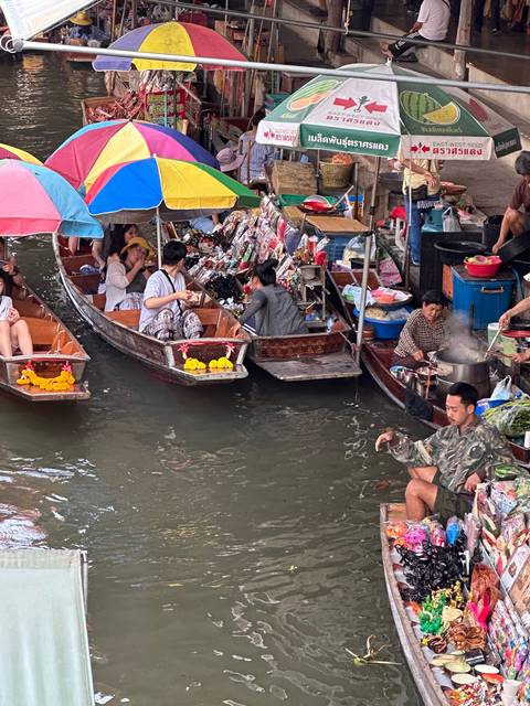 Floating market scene with vibrant colors.