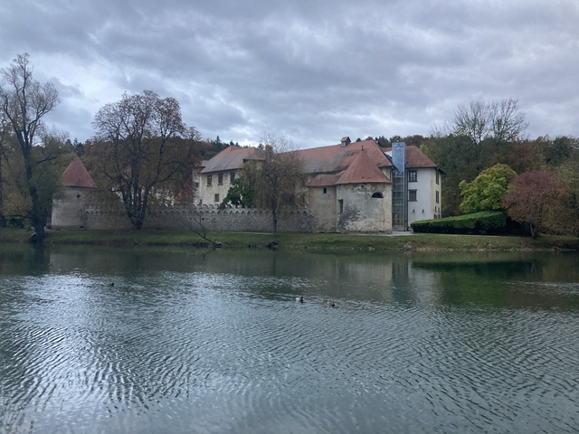       A castle by a river in Otocec.
  