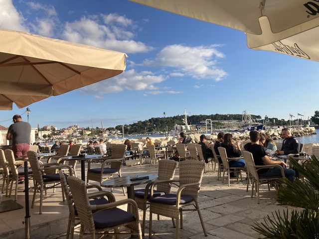       Outdoor cafe overlooking a harbor.
  