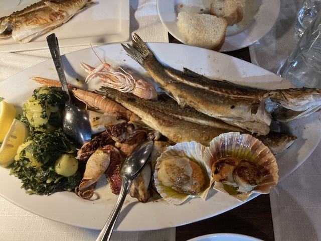       Seafood platter with grilled fish and shellfish.
  