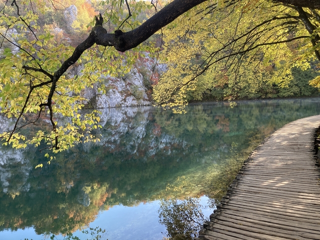       Tranquil lake with autumn foliage at Plitvice.
  