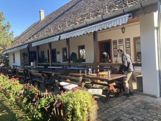       Outdoor seating area at a rustic restaurant.
  