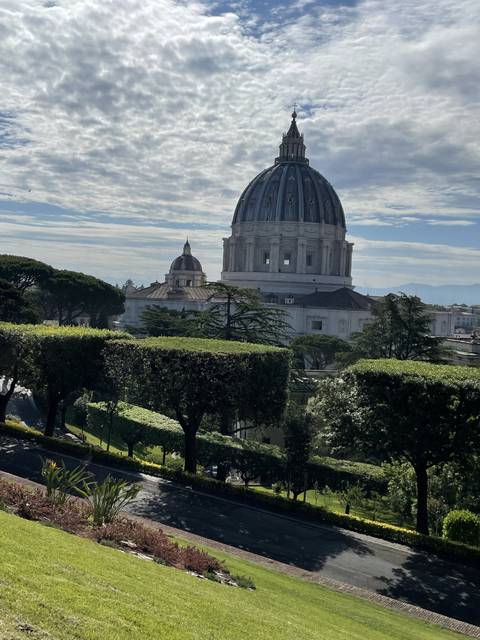       View of St. Peter's Basilica from a garden.
  