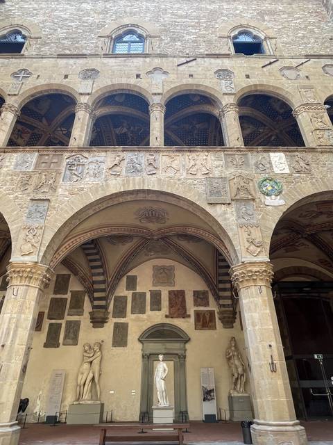       An ornate wall inside a historic building.
  