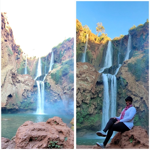 Stunning waterfall with a person at its base.