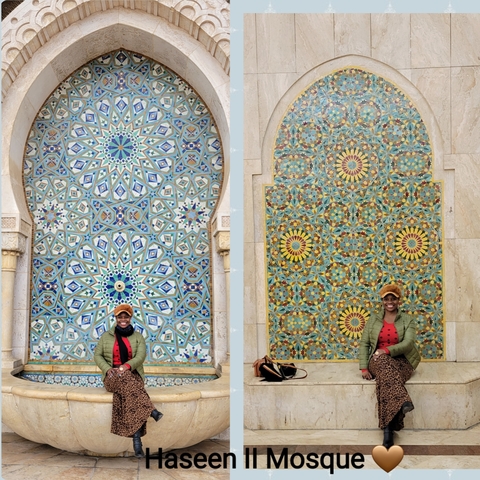 Person sitting in front of colorful tiled wall panels.