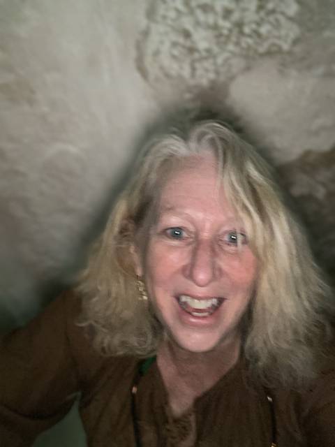       Close-up of a smiling woman indoors.
  