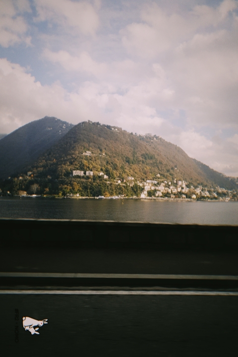      Hillside town overlooking a lake.
  