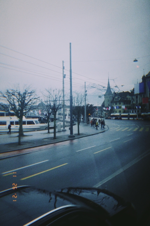       Urban street with trams and buildings.
  