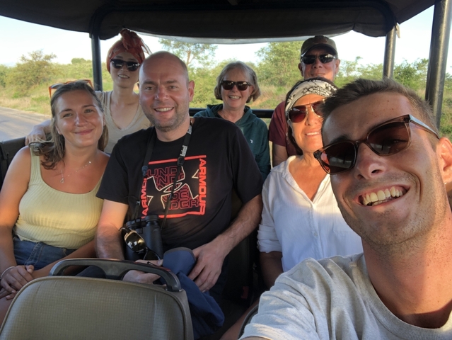 Group of people taking a selfie on a safari.