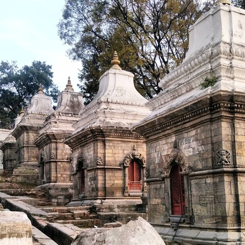       Row of stone shrines with intricately carved details.
  