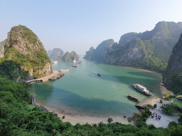       A breathtaking view of Halong Bay with boats on the water.
  