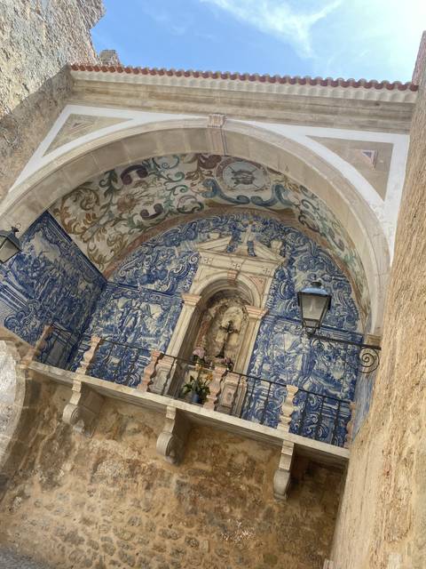 Intricate tile decoration on a historic structure.
