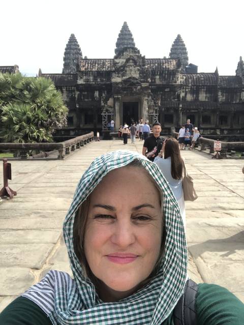       Selfie with Angkor Wat temple in the background.
  