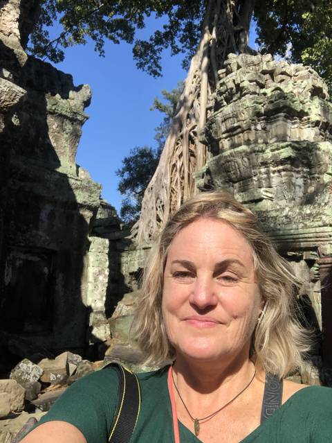       Selfie with tree roots over temple ruins.
  