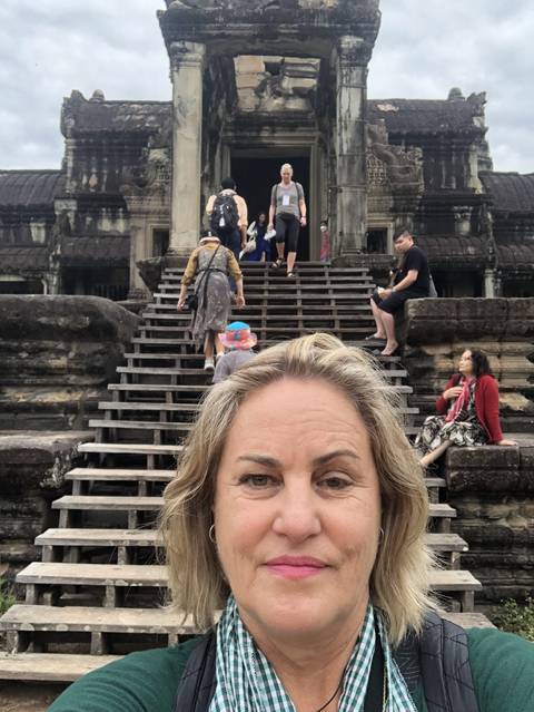       Selfie with Angkor Wat temple and visitors.
  