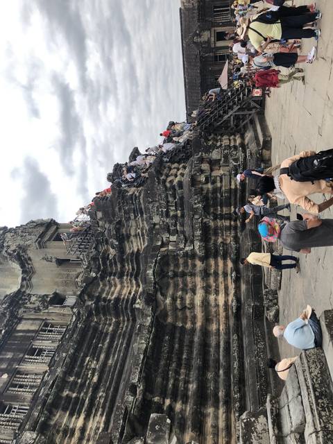       Crowd of tourists at Angkor Wat.
  