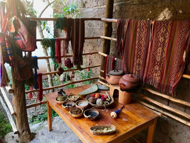       A rustic setup with pots and dyed yarn.
  