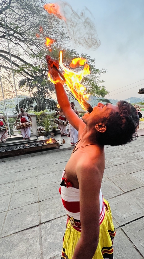 Man performing a fire-eating act.