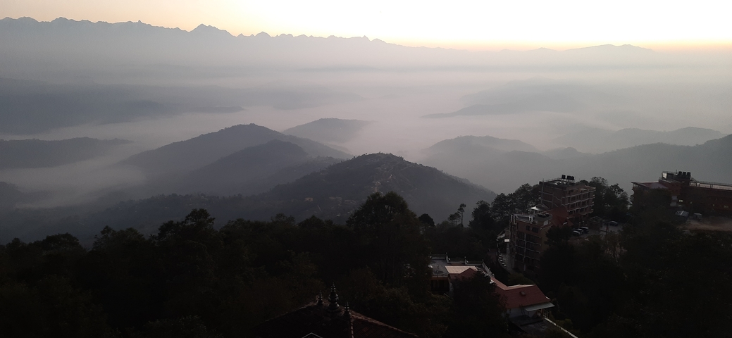 Sunset view over the misty hills and mountains.