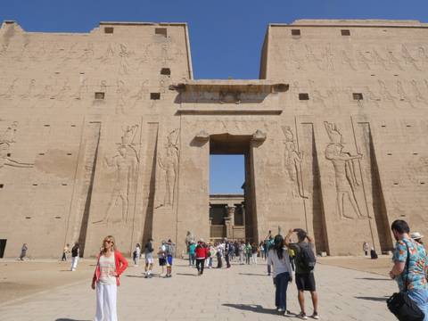       People visiting an ancient Egyptian temple.
  