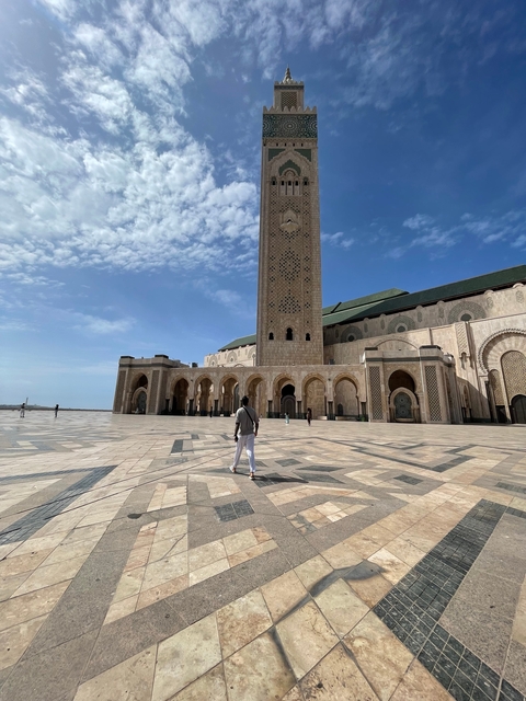 Mosque exterior with person walking