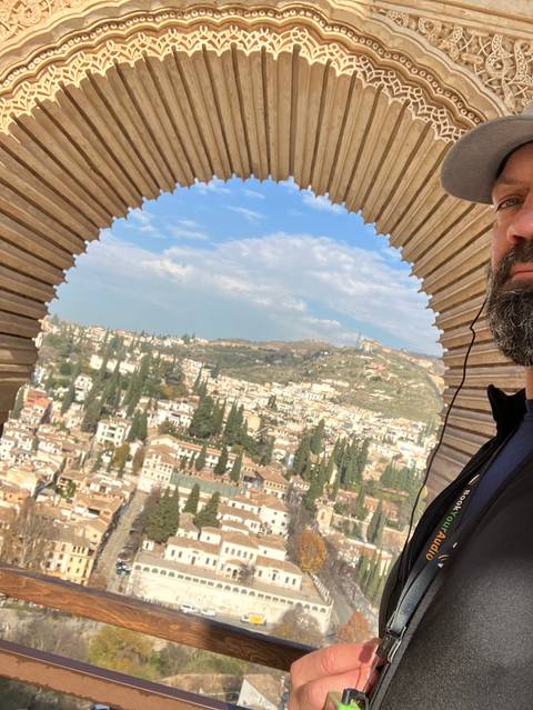 View of a cityscape through a decorative archway.