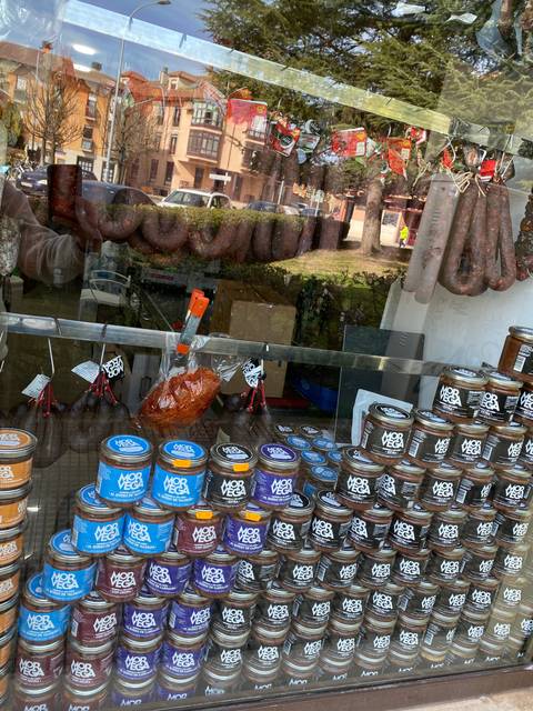       Storefront with jars and containers displayed prominently.
  