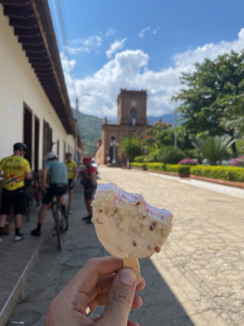 Focus on an ice cream bar with a historic building in the background.