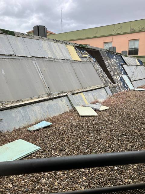       Close-up of an industrial or construction area with concrete and metal elements.
  