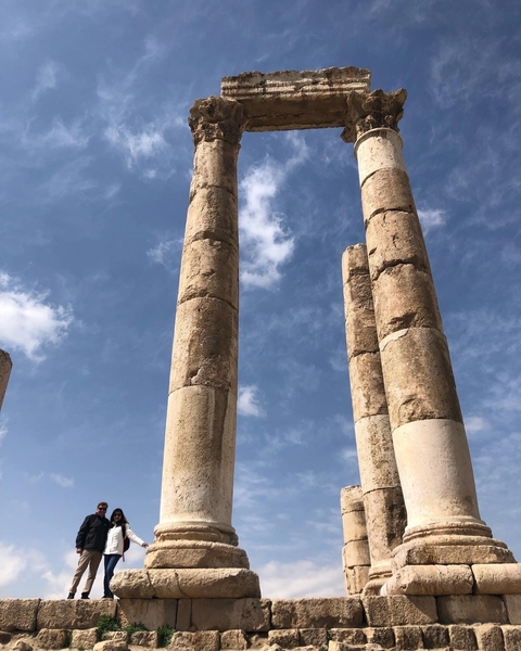 Ancient stone columns against a blue sky.