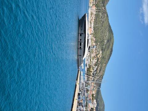       Upside-down view of a marina and water.
  