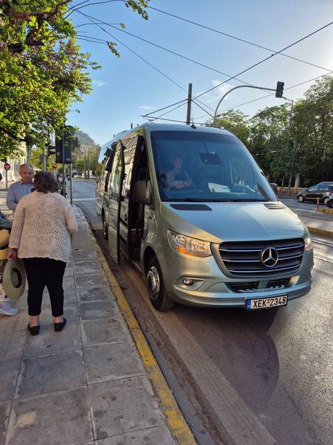 Tourist bus parked on a street.