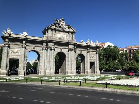 Upside-down view of an archway with statues.