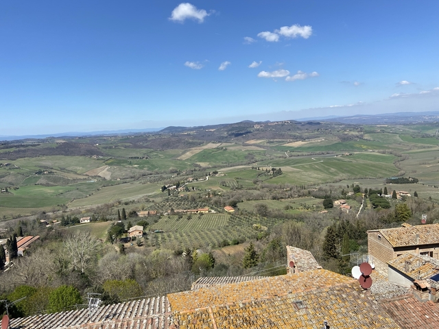       Panoramic view of rolling hills and fields.
  